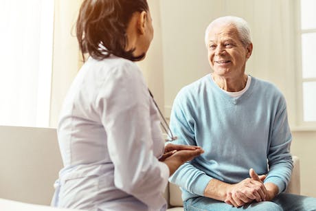 Doctor discussing prostate cancer risk with a male patient